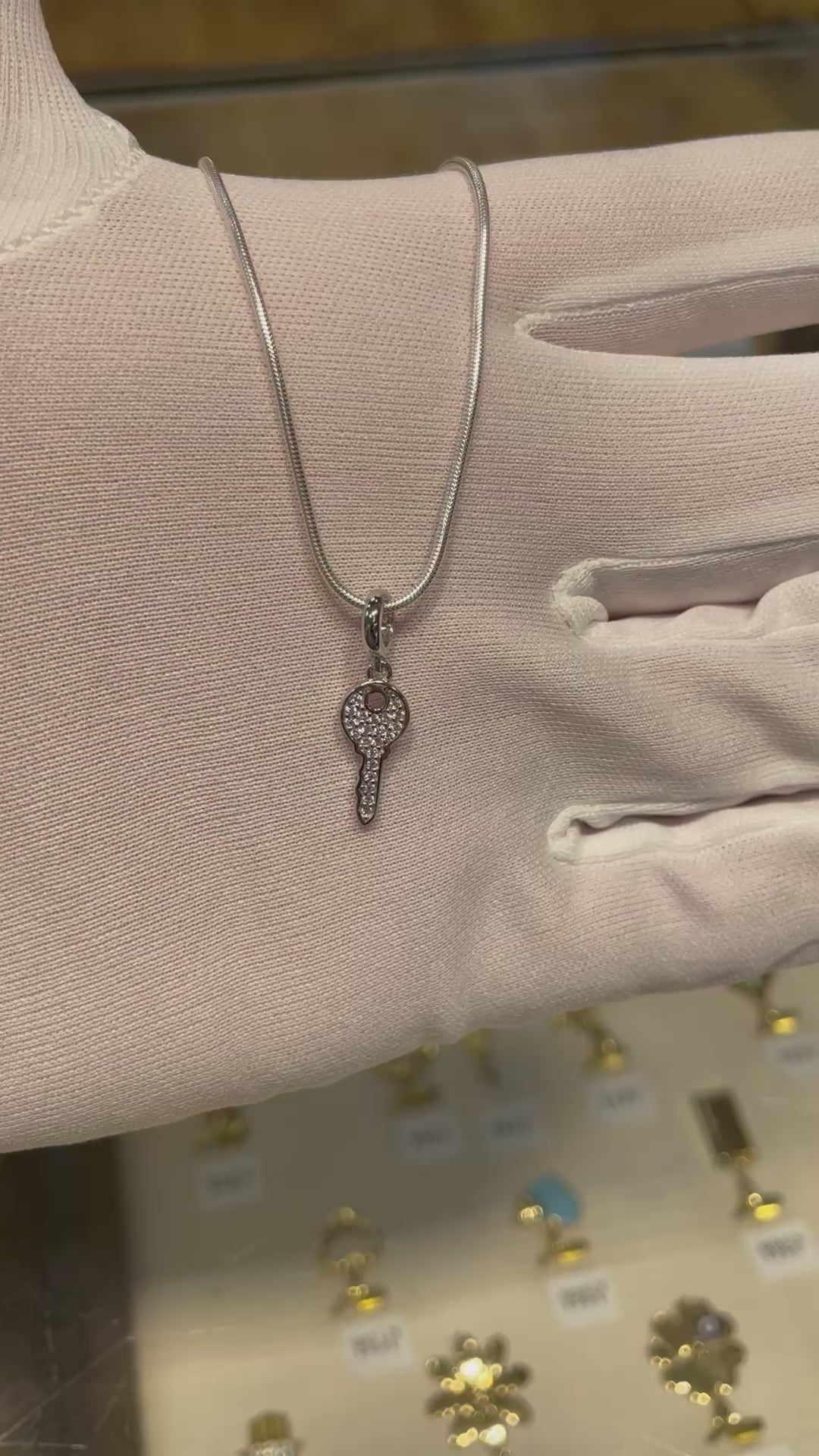 Key pendant with a chain on the hand